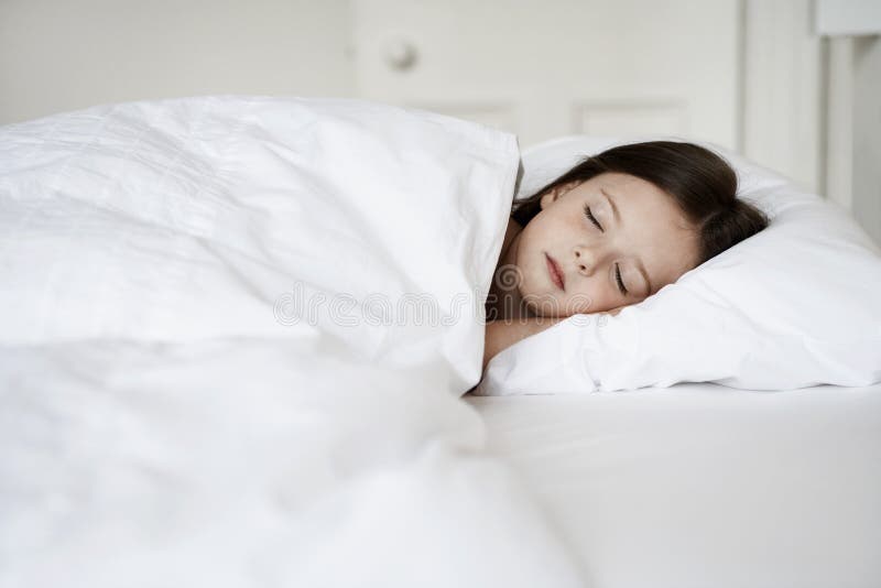 Little Girl Sleeping In Bed