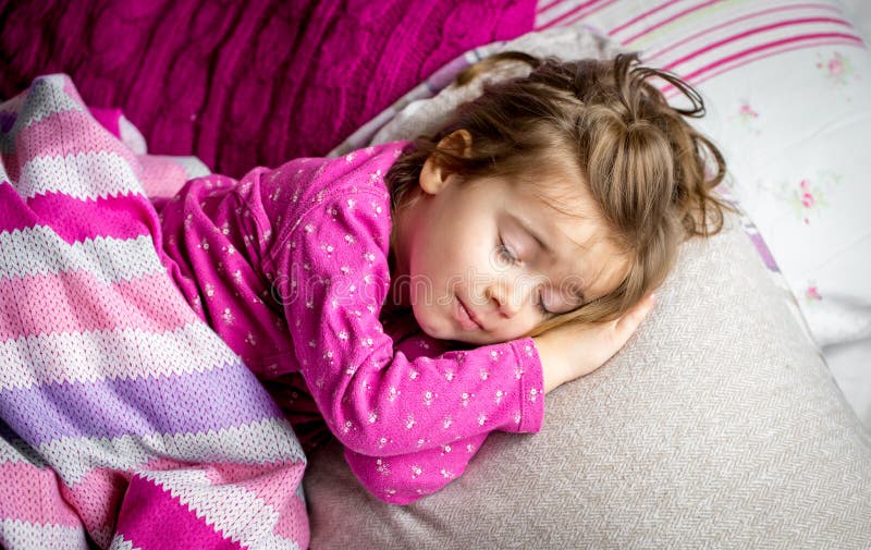 Little Girl Sleeping in a Pink Bed Stock Image - Image of feet, bedding ...