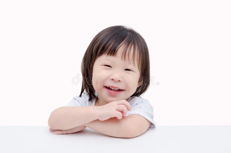 Little girl smiles over white