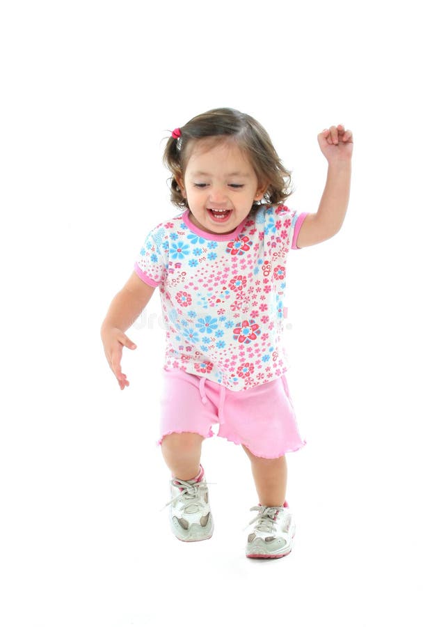 Little girl smiling and dancing