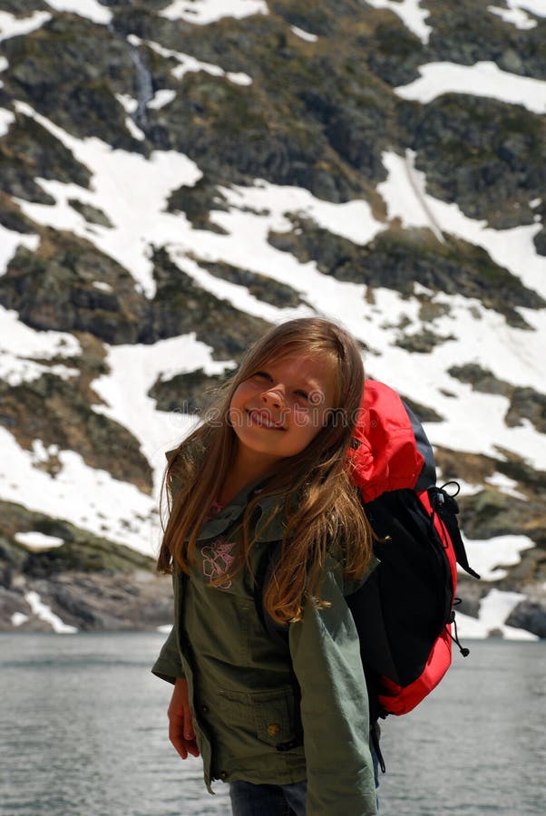 Little girl smiling doing walk in Hight mountains