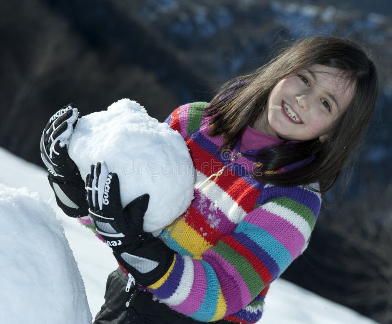 Little girl with snowball