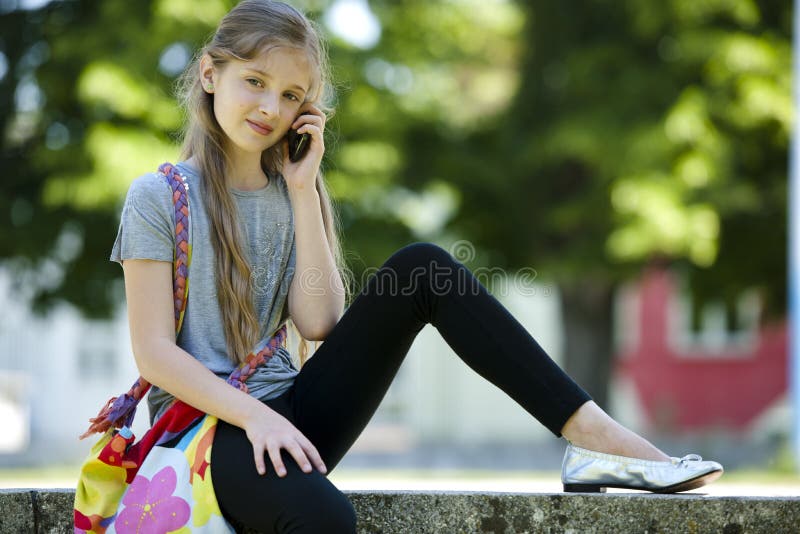 Little girl speaking on mobile phone