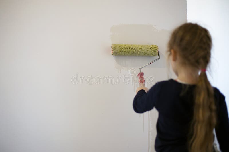 Little Girl Stands with Her Back and Paints a Wall Stock Photo Image of concept, little 174268292