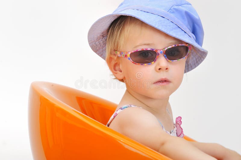 Newborn Baby Girl Wearing Sunglasses and a Bikini Top Stock Image