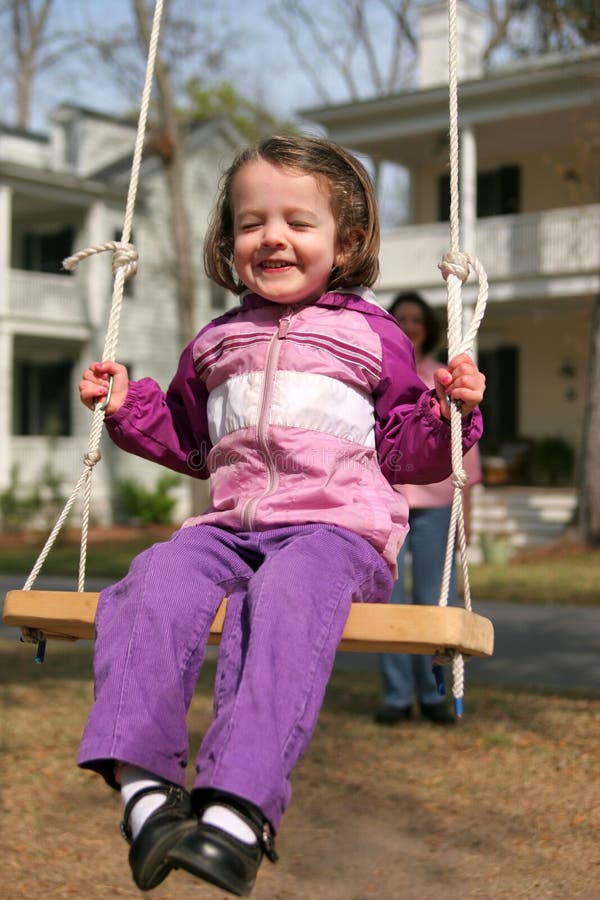 Little Girl Swinging On Rope Swing Picture. Image 6415878