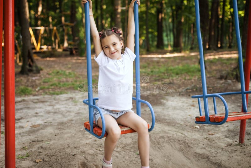 Little girl at swings