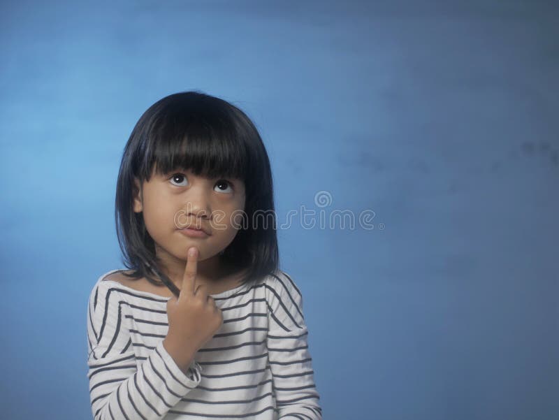 Portrait of little Asian baby girl shows thinking gesture, indonesian, malaysian, thai, curious, finger, person, child, ask, chin, imagination, elementary, dreaming, question, curiosity, education, lovely, adorable, alone, female, kid, childhood, chinese, casual, cheerful, happy, looking, thoughtful, up, lifestyle, beautiful, smile, cute, confused, smart, idea. Portrait of little Asian baby girl shows thinking gesture, indonesian, malaysian, thai, curious, finger, person, child, ask, chin, imagination, elementary, dreaming, question, curiosity, education, lovely, adorable, alone, female, kid, childhood, chinese, casual, cheerful, happy, looking, thoughtful, up, lifestyle, beautiful, smile, cute, confused, smart, idea