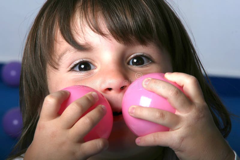 Little Girl and Toy Balls