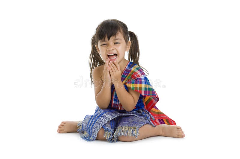 Little girl in traditional thai laughing