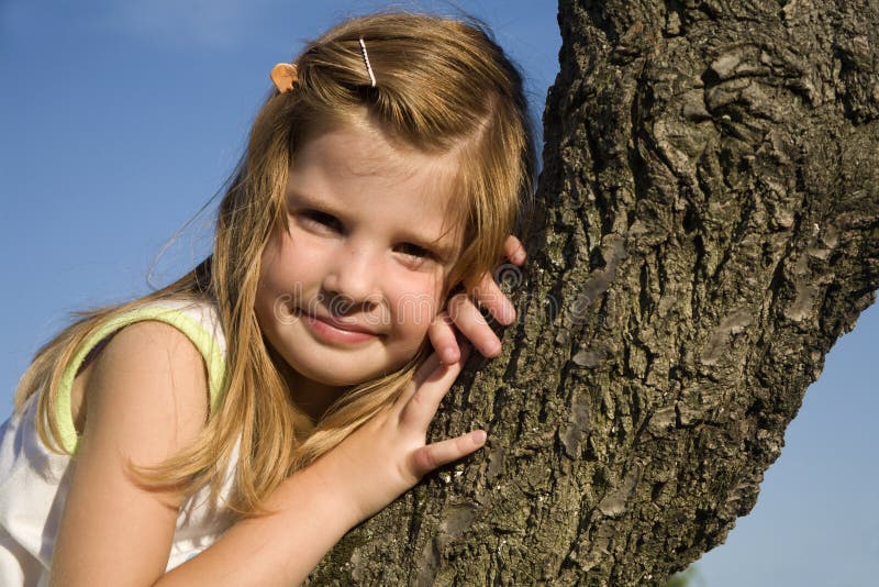 Little girl on the tree