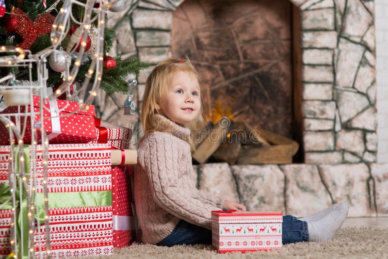 Little girl with Christmas stock image. Image of little - 133746559