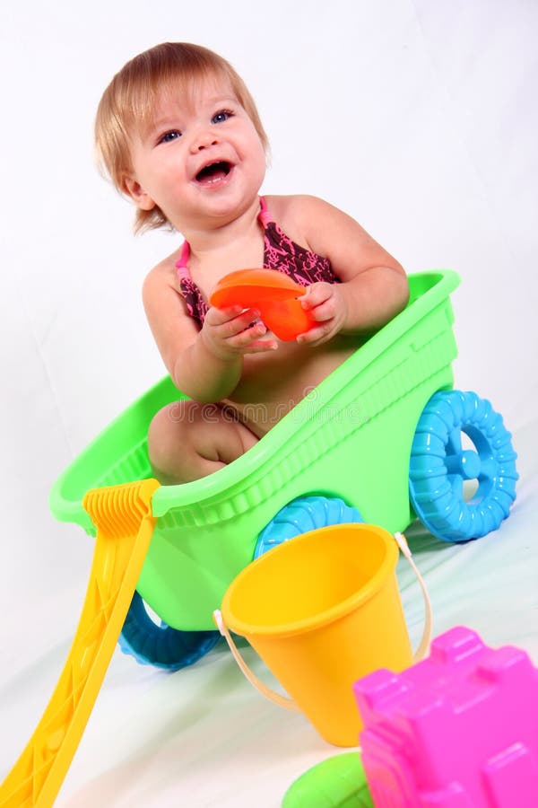 Little Girl in Wagon Laughing