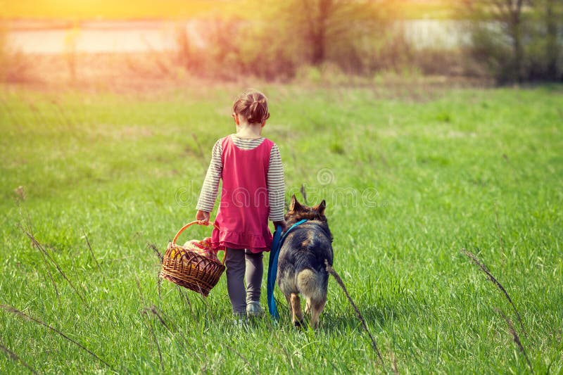Little girl walking with dog stock photo Little girl walking with dog stock photo