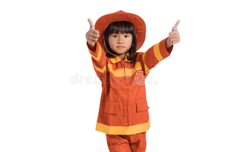 Little girl wearing firefighter uniform with thumbs up hands gesture royalty free stock images Little girl wearing firefighter uniform with thumbs up hands gesture royalty free stock images