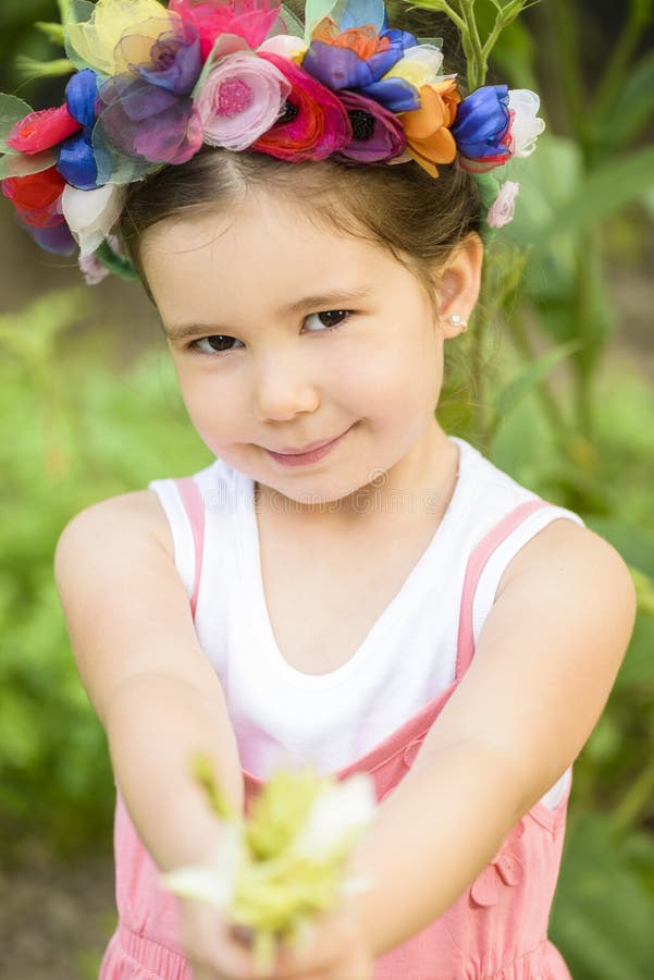 Little Girl Wearing Flower Wreath and Bouquet of Flower Stock Image ...