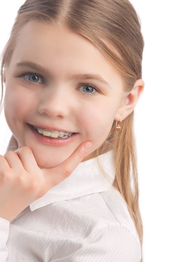 Little girl wearing teeth braces