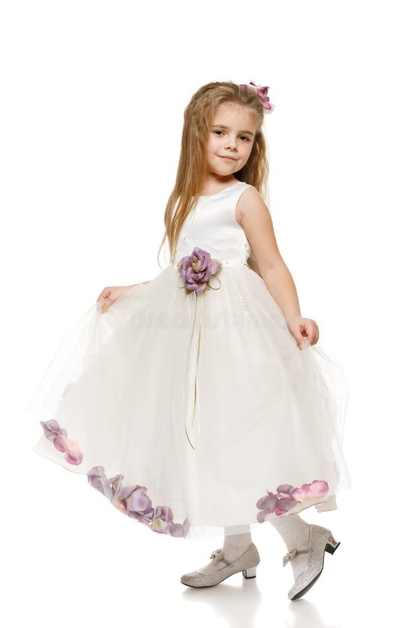 Little girl in white ball dress stock photos