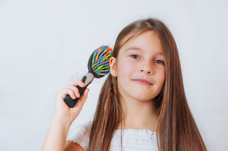 Cute Smiling Little Girl Combing Her Hair Comb Makes Hair Stock Photo - Image of background, fashion: 168401332 Cute Smiling Little Girl Combing Her Hair Comb Makes Hair Stock Photo - Image of background, fashion: 168401332