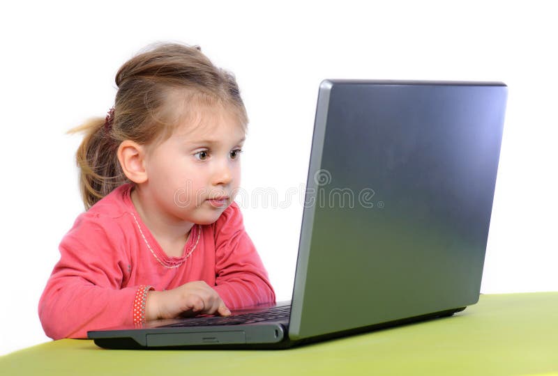 Little girl wih laptop royalty free stock photos