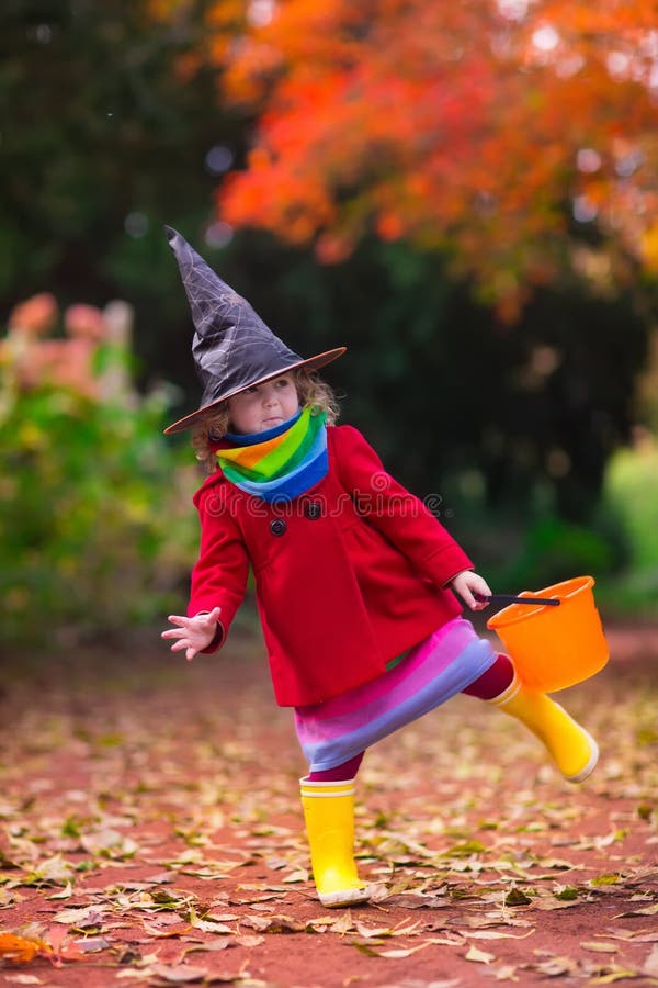 Little girl in witch costume at Halloween stock images Little girl in witch costume at Halloween stock images
