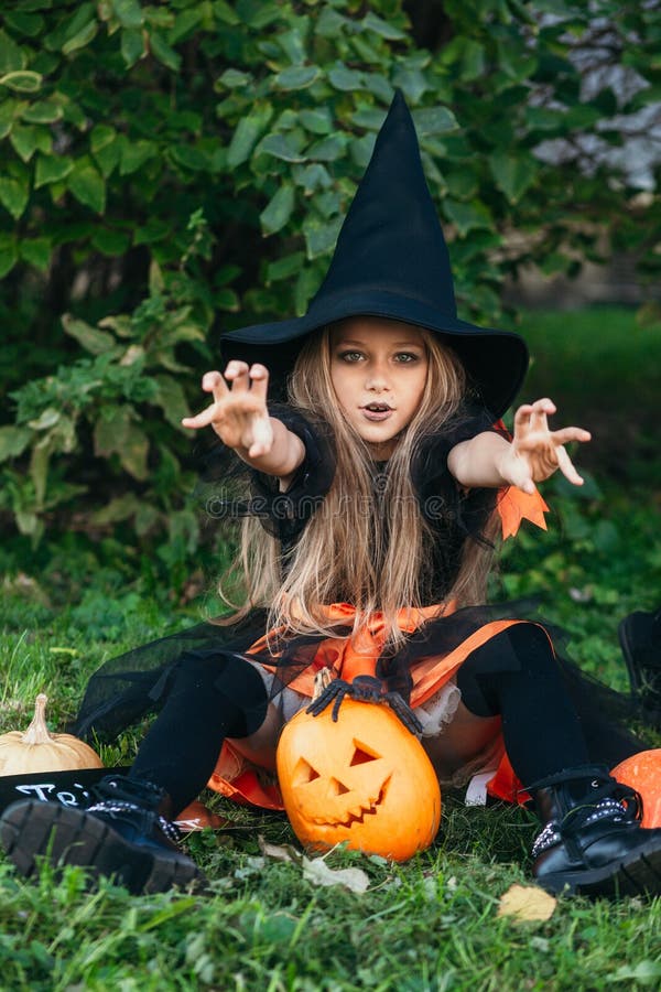 Little Girl in Witch Costume Having Fun on Halloween Trick or Treat ...