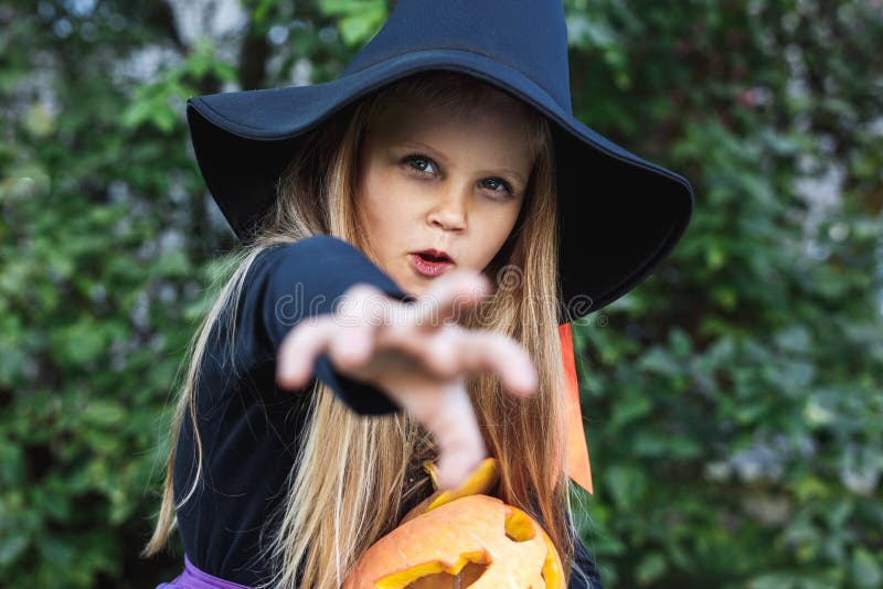 Little Girl in Witch Costume Having Fun on Halloween Trick or Treat ...