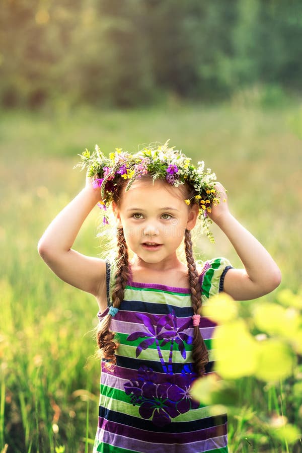 Little Girl in a Wreath of Wild Flowers in Summer Stock Photo - Image ...