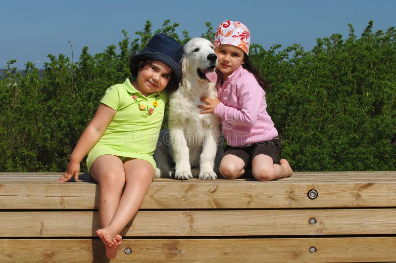 Little girls with a Golden retriever