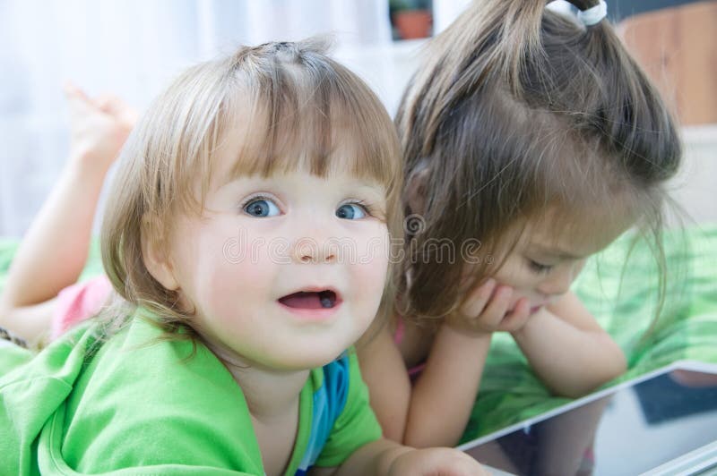 Children Using Tablet Lying On Bed At Home Children Time Spending