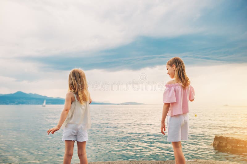 Outdoor Portrait Of Two Sweet Little Girls Stock Photo Image Of Lake
