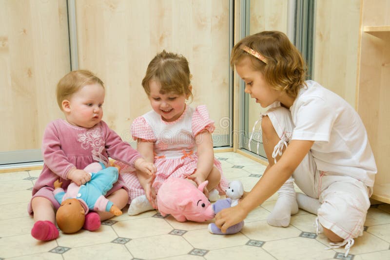 Little girls playing together royalty free stock images