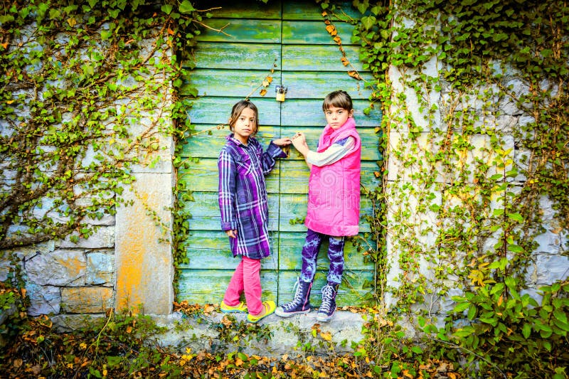 Little Girls Standing in Front of the Doors Stock Image Image of