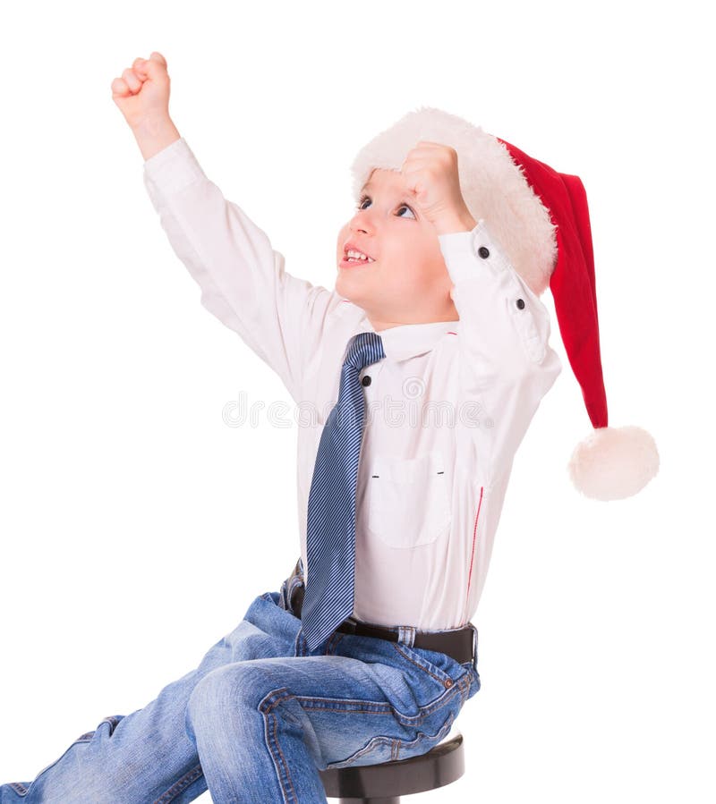 Little happy boy in red santa hat royalty free stock photo Little happy boy in red santa hat royalty free stock photo