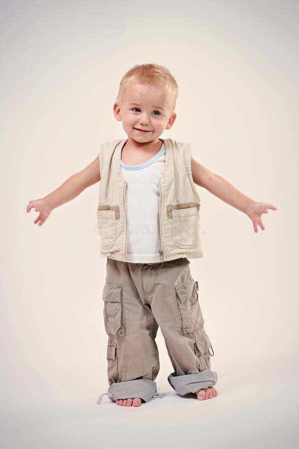 Little happy boy in studio