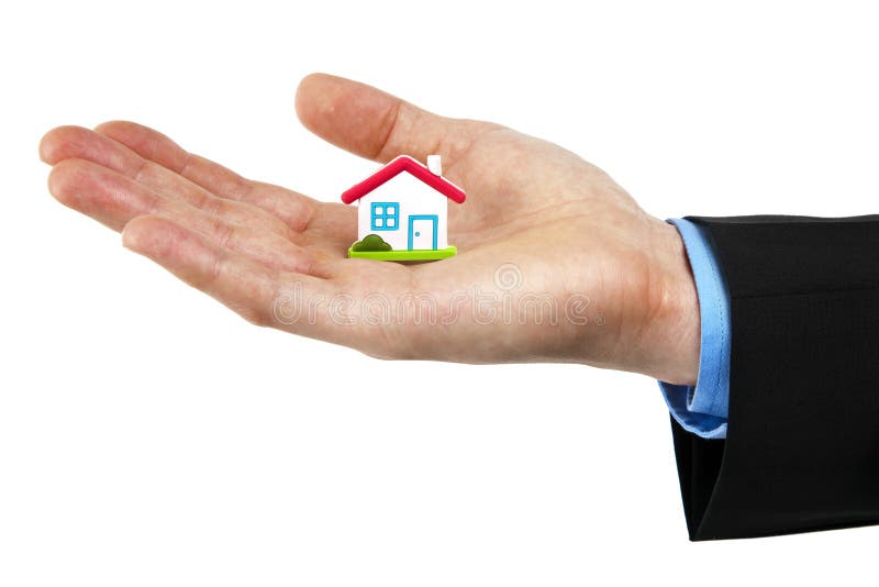 Little house symbol in hand royalty free stock photography