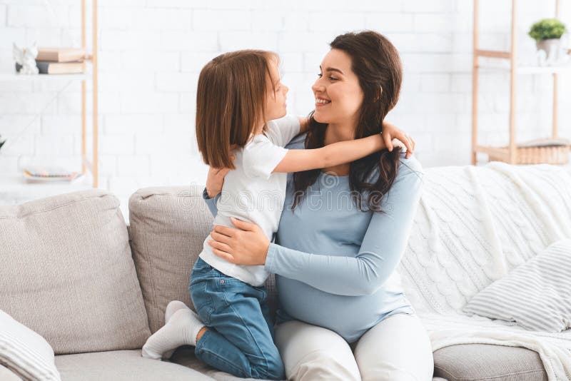 Little Kid Hugging Pregnant Mom Home Interior Stock Image Image Of
