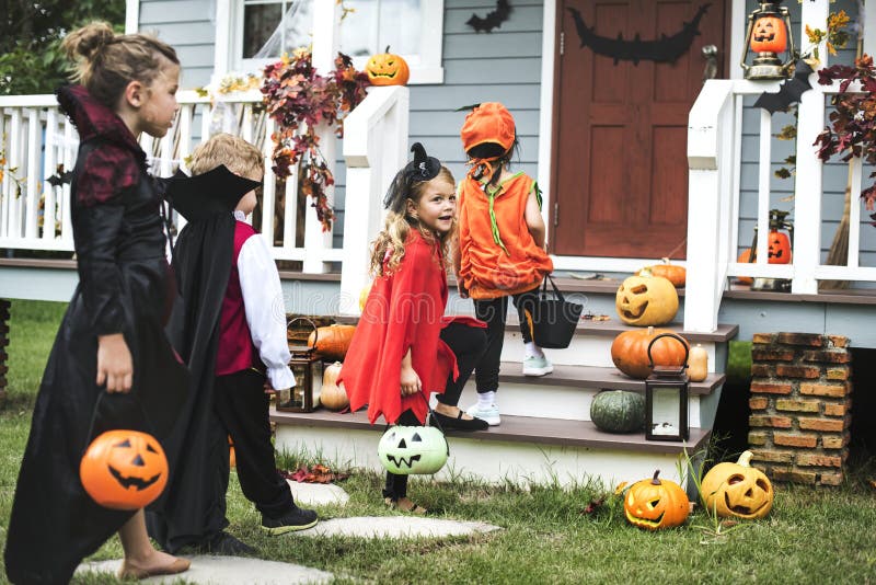 Little Kids Trick or Treating Stock Photo - Image of clothing, group ...