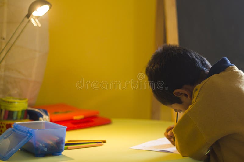A little latin boy doing homework. royalty free stock photography A little latin boy doing homework. royalty free stock photography
