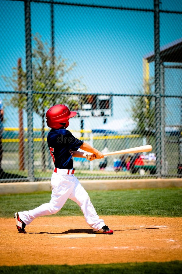Little League Player Swinging Bat Stock Images Image 29927424