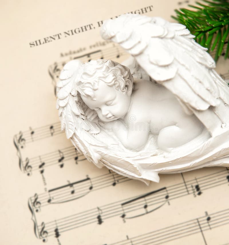 Little lovely sleeping angel with christmas decoration