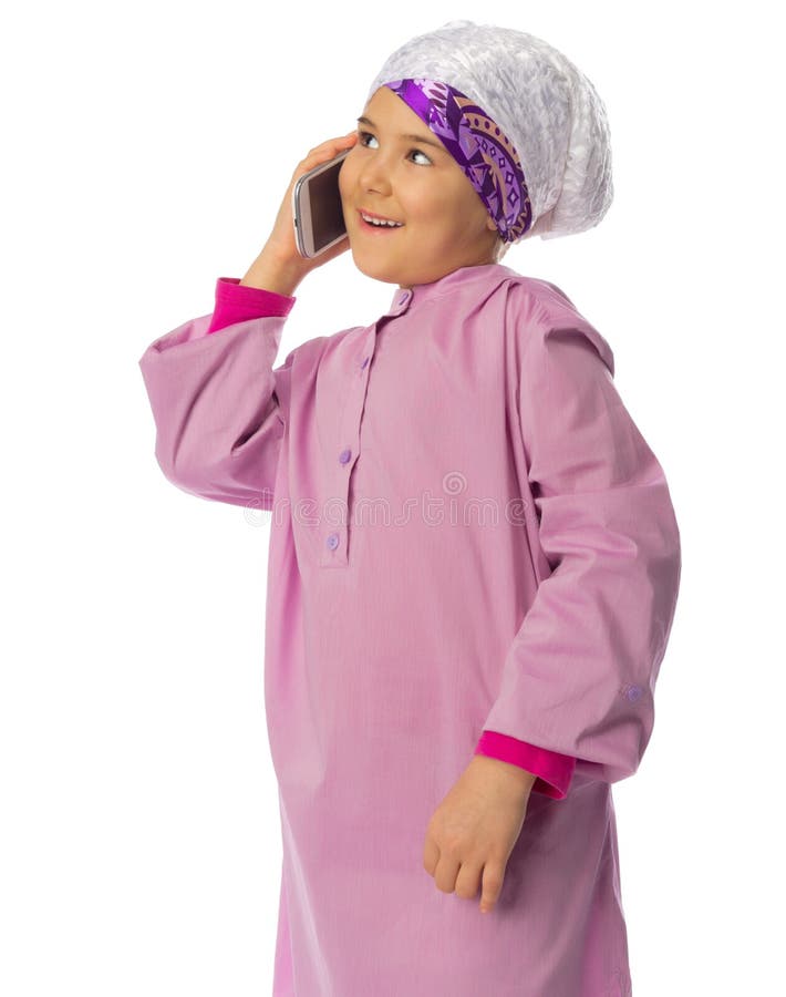 Little Girl in Traditional Muslim Clothes with Laptop Stock Image