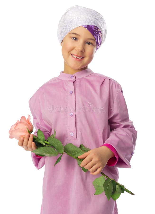 Little Girl in Traditional Muslim Clothes with Laptop Stock Photo