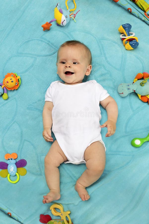 A Little Newborn Baby Boy is Lying on a Blue Blanket Stock Image ...