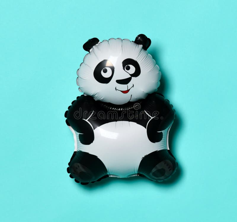 Little panda balloon for present on birthday on light blue green