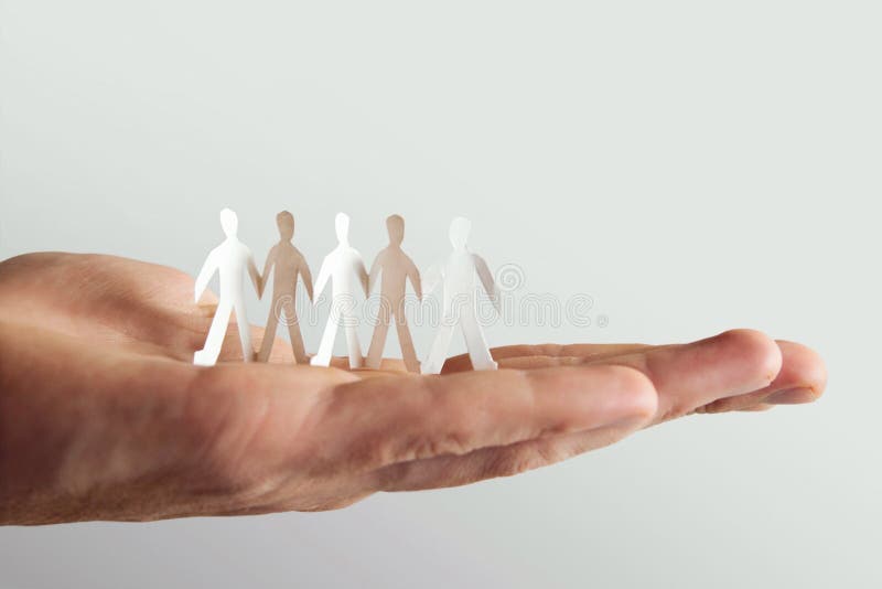 Little paper cutout people on hand stock images