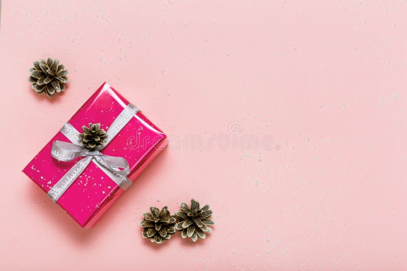 Pink ribbon for gift wrapping on a solid pink background Stock Photo