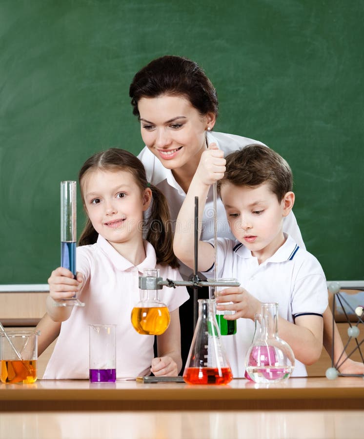 Little pupils study chemistry at laboratory class stock photo