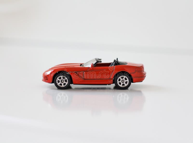 Little red toy sports car on a white background royalty free stock photos Little red toy sports car on a white background royalty free stock photos