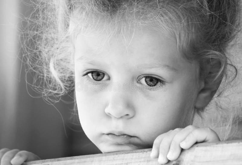 Little sad girl on the playground. stock image Little sad girl on the playground. stock image